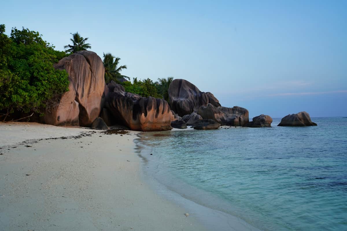 Massive granite boulders and white sand at Anse Source d'Argent beach on La Digue island, Seychelles