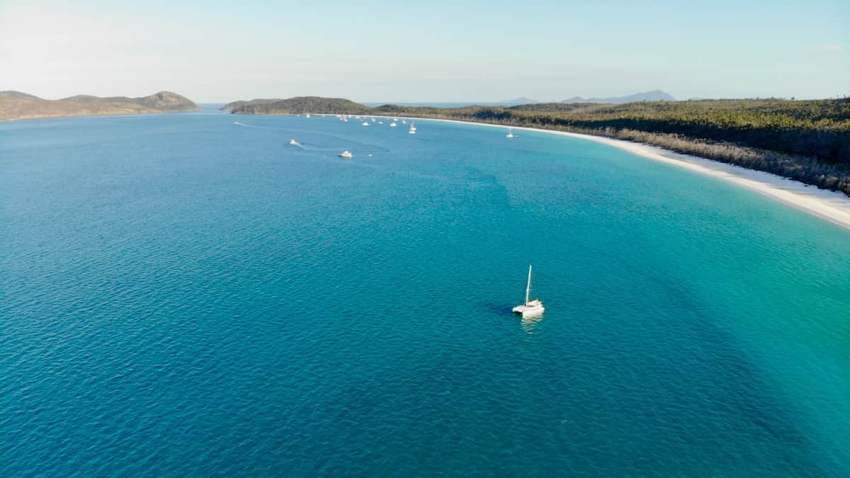 Bright white silica sand and turquoise water at Whitehaven Beach on Whitsunday Island, Australia
