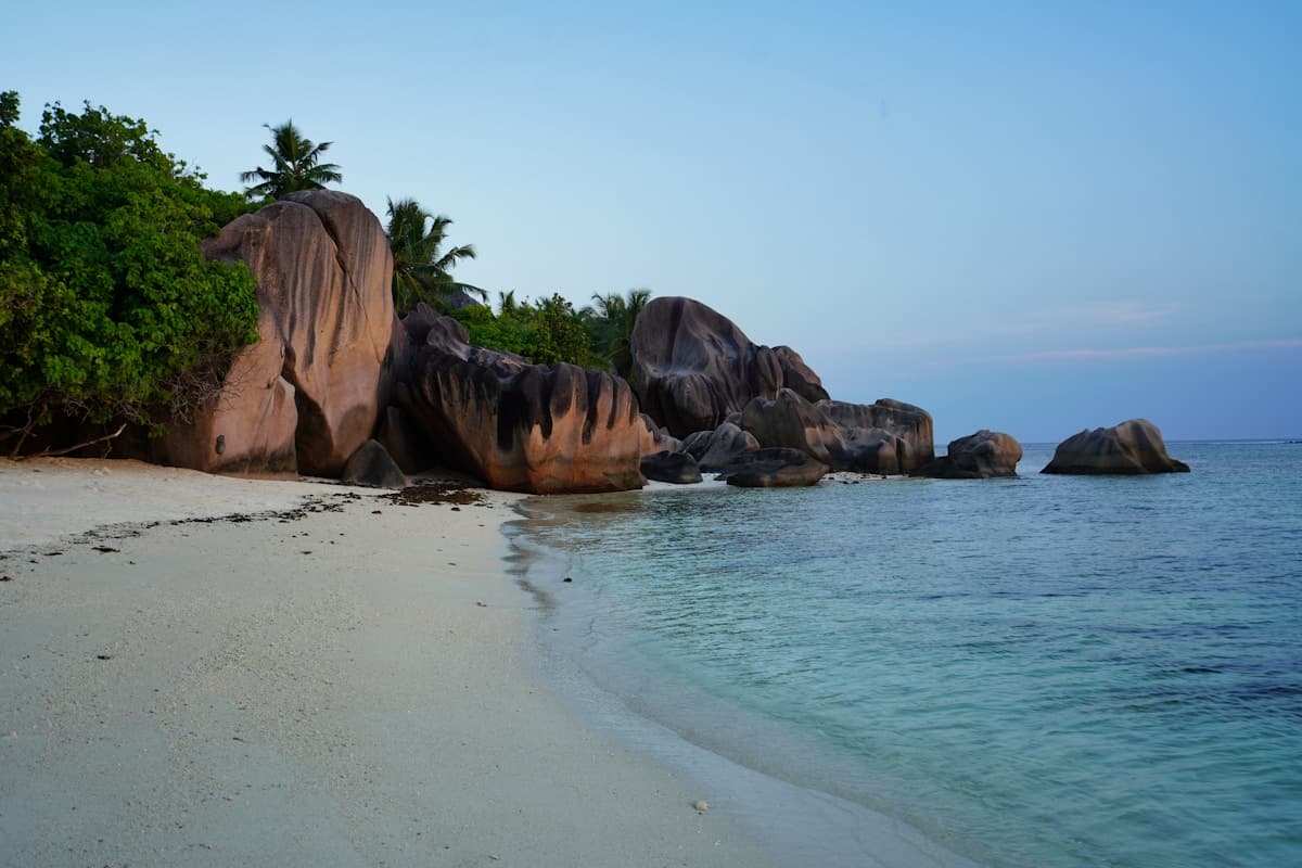 Massive granite boulders and white sand at Anse Source d'Argent beach on La Digue island, Seychelles