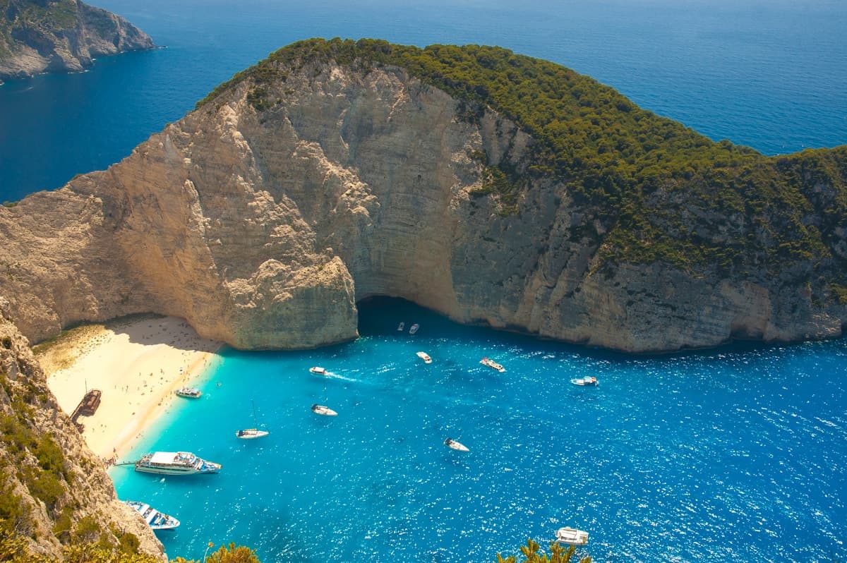 Aerial view of Navagio Shipwreck Beach in Zakynthos with turquoise water and white limestone cliffs