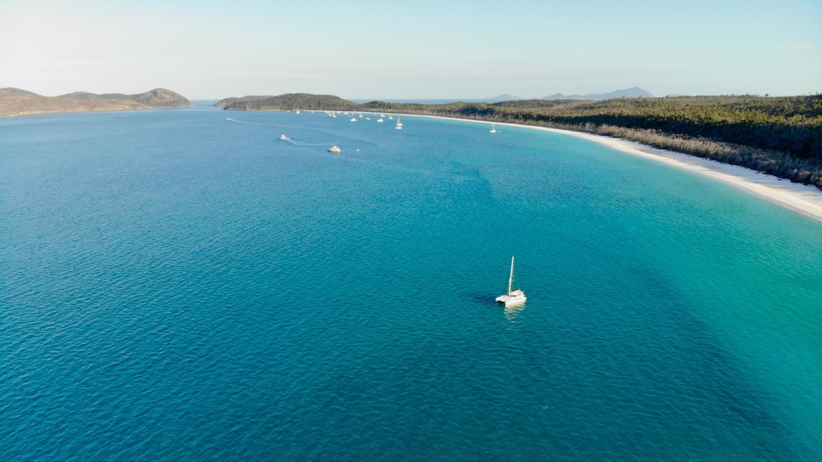 Bright white silica sand and turquoise water at Whitehaven Beach on Whitsunday Island, Australia