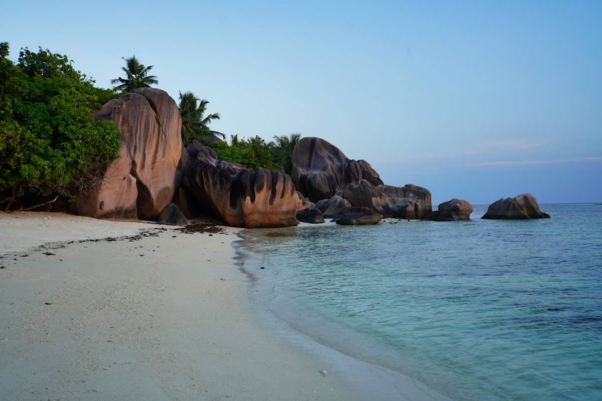 Massive granite boulders and white sand at Anse Source d'Argent beach on La Digue island, Seychelles