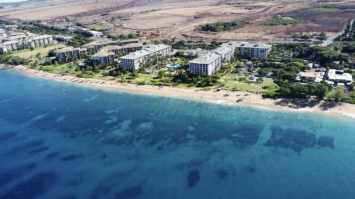 Kahekili Beach Park on West Maui with the reef visible offshore and the West Maui Mountains in the distance