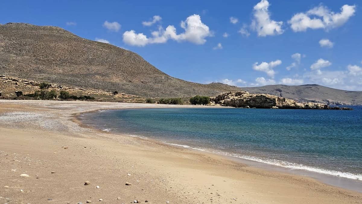 Karoumes Beach east Crete at the end of Chochlakies Gorge with calm Aegean water and pebble shore
