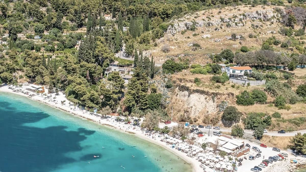 Kasjuni Beach Split with the Marjan pine forest behind and clear Adriatic turquoise water