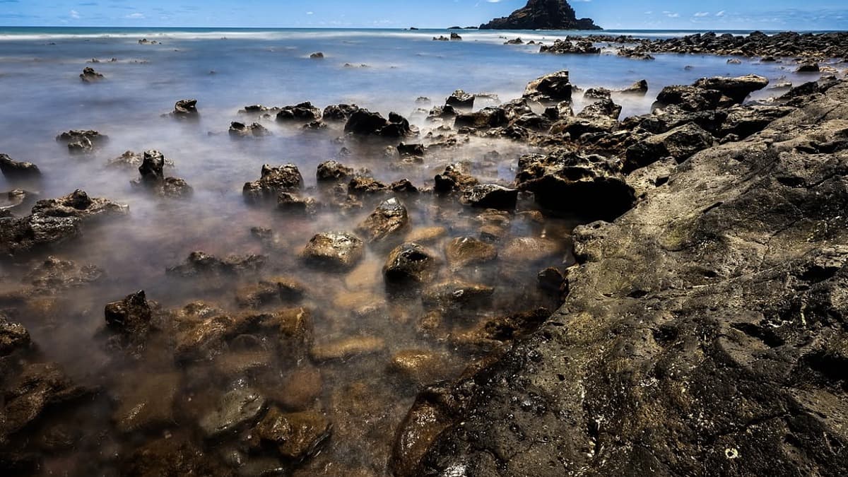 Koki Beach Maui with red sand and cone-shaped Alau Island offshore near Hana