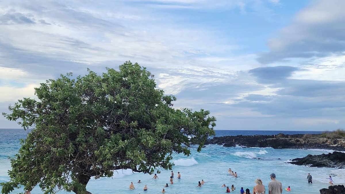 Kua Bay Beach (Manini'owali) Big Island with white sand, turquoise water, and lava rock cliffs at the ends