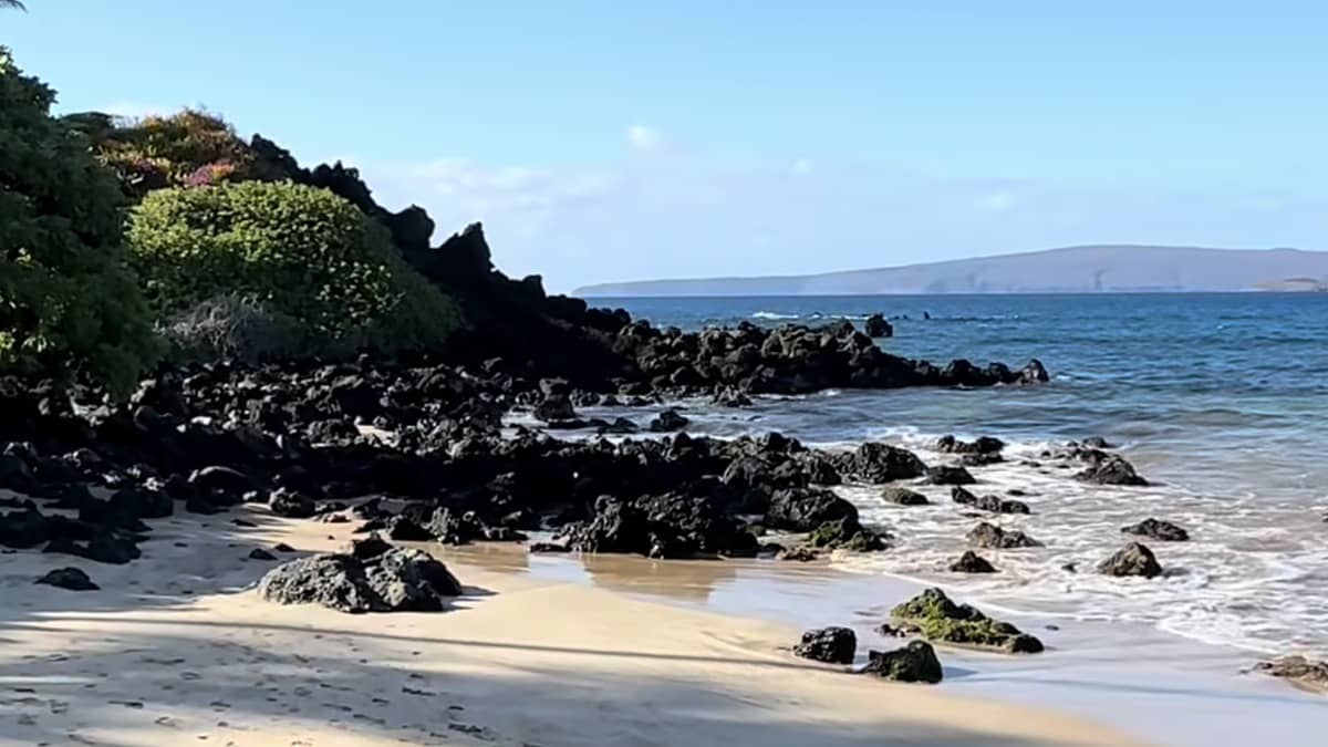 Palauea Beach (White Rock) in Wailea Maui with the lava rock points framing the white-sand crescent