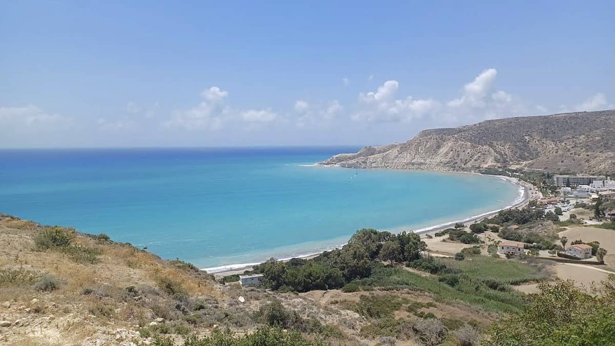 Pissouri Beach Cyprus with the white cliffs of Cape Aspro framing the Blue Flag bay