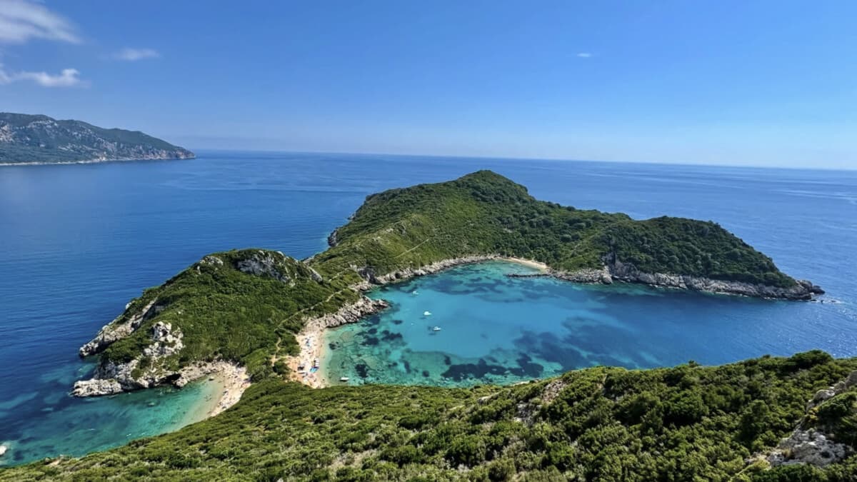 Porto Timoni on Corfu, two clear turquoise bays back to back on a narrow headland below Afionas, seen from the viewpoint on the trail above
