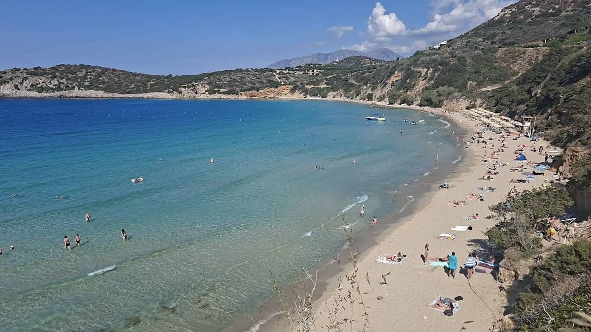 Voulisma Beach east Crete with the half-moon golden sand and shallow turquoise water at Istron