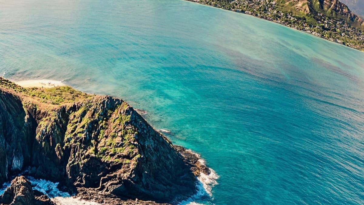 Turquoise water and the Mokulua islands offshore from Lanikai Beach, Oahu