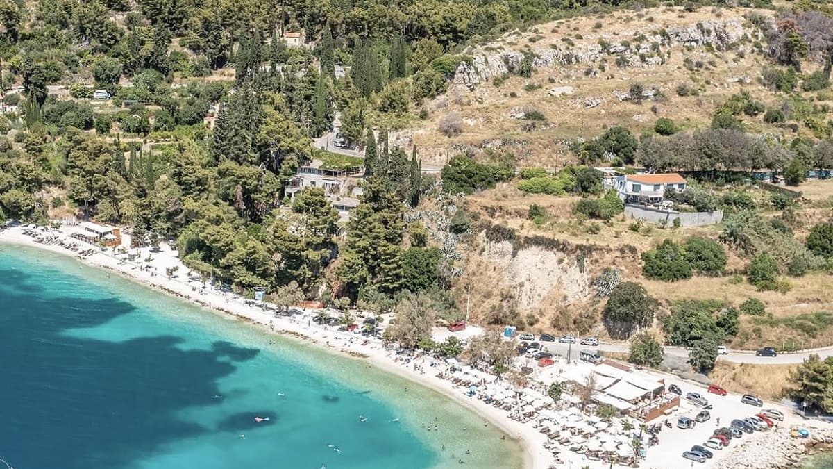 Kasjuni Beach Split with the Marjan pine forest behind and turquoise Adriatic water