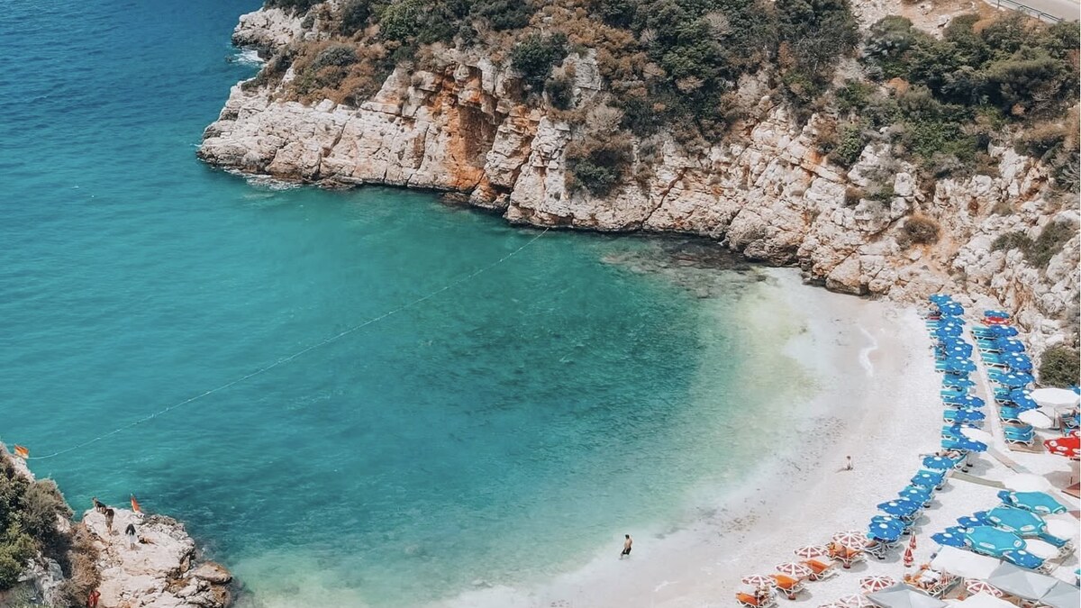 Kaputas beach between Kas and Kalkan in Turkey, a small cove of bright turquoise water framed by steep gorge cliffs