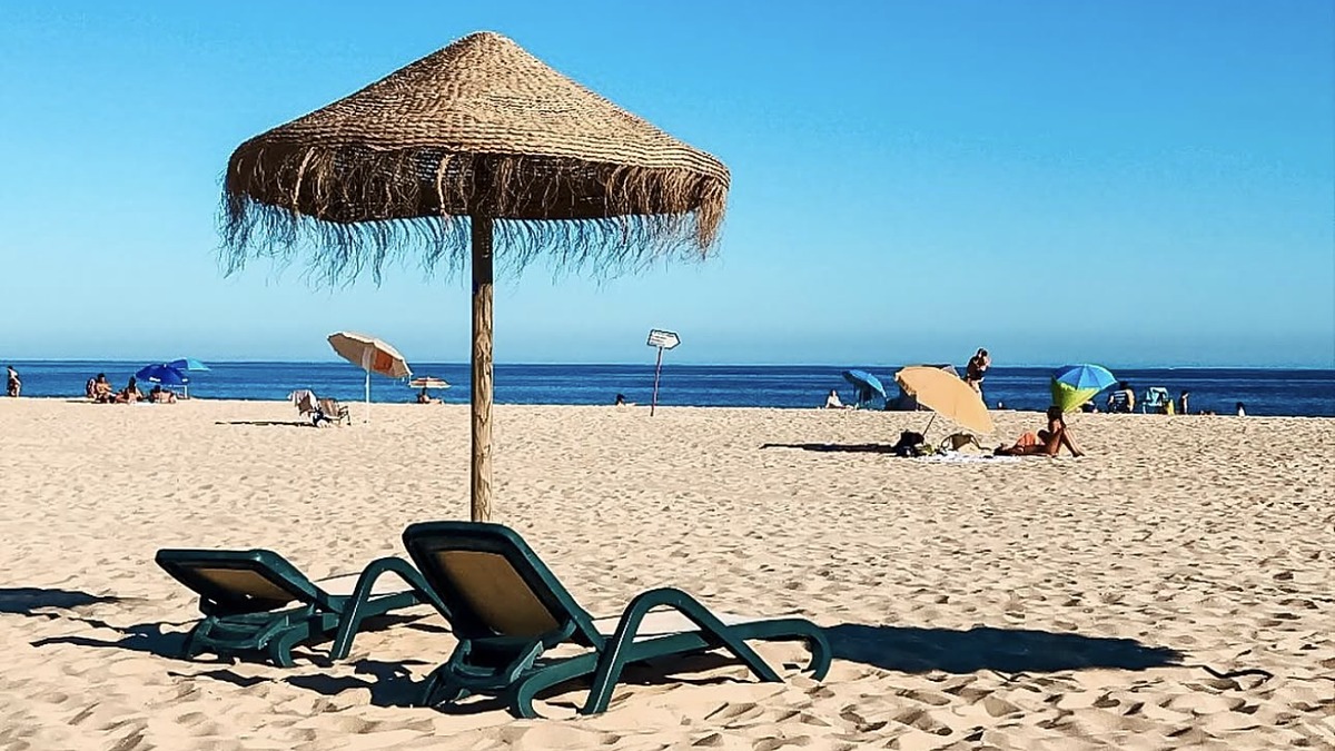 Meia Praia east of Lagos, a long flat golden-sand beach with gentle waves, Algarve