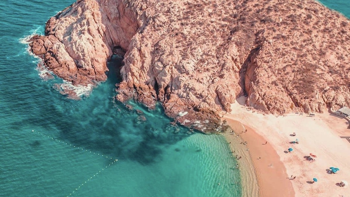 Santa Maria Cove's horseshoe-shaped protected bay with snorkelers