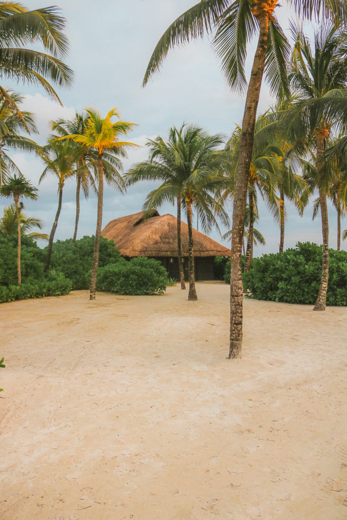 Calm shallow turquoise water at Xpu-Ha beach with white sand