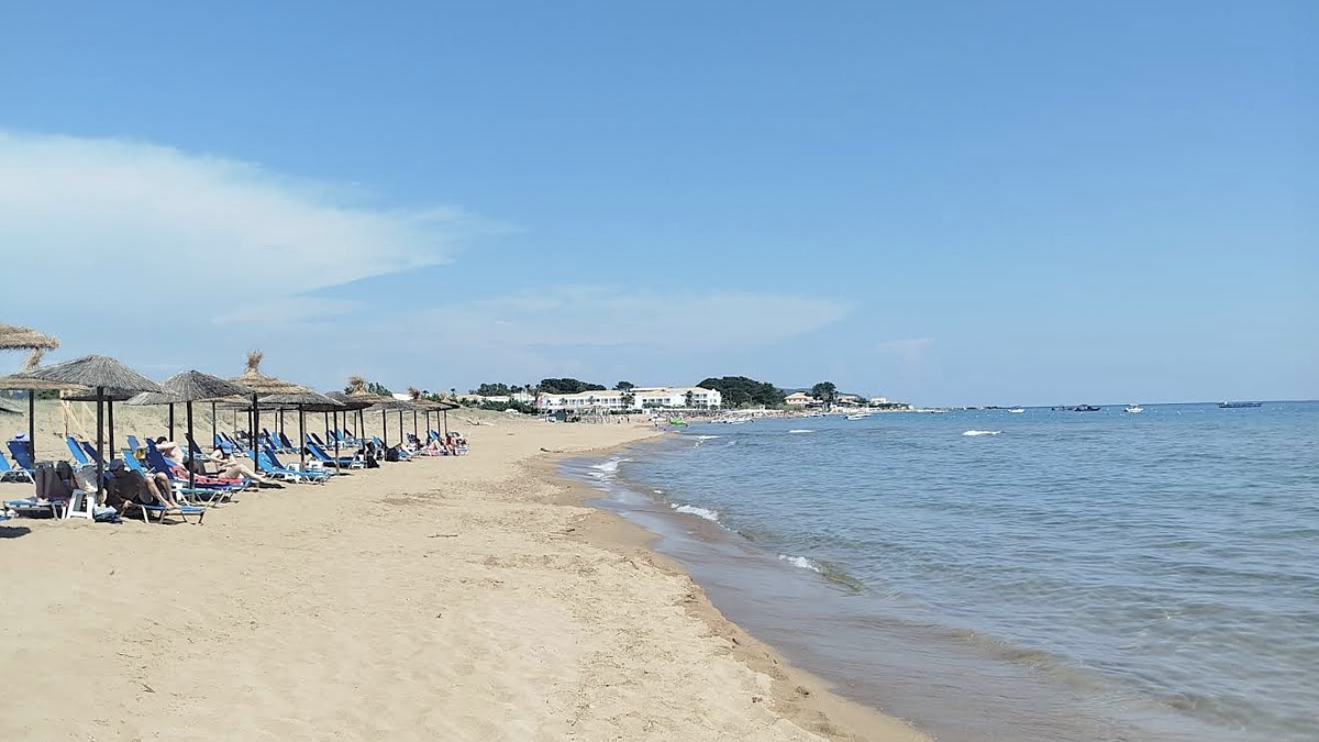 Issos Beach on the south coast of Corfu, a wide dune-backed sandy beach near Lake Korission