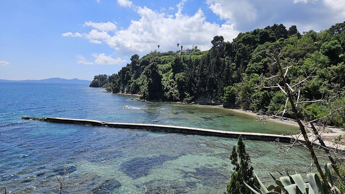 Mon Repos Beach near Corfu Town, a small pebble swim set below the wooded royal estate gardens