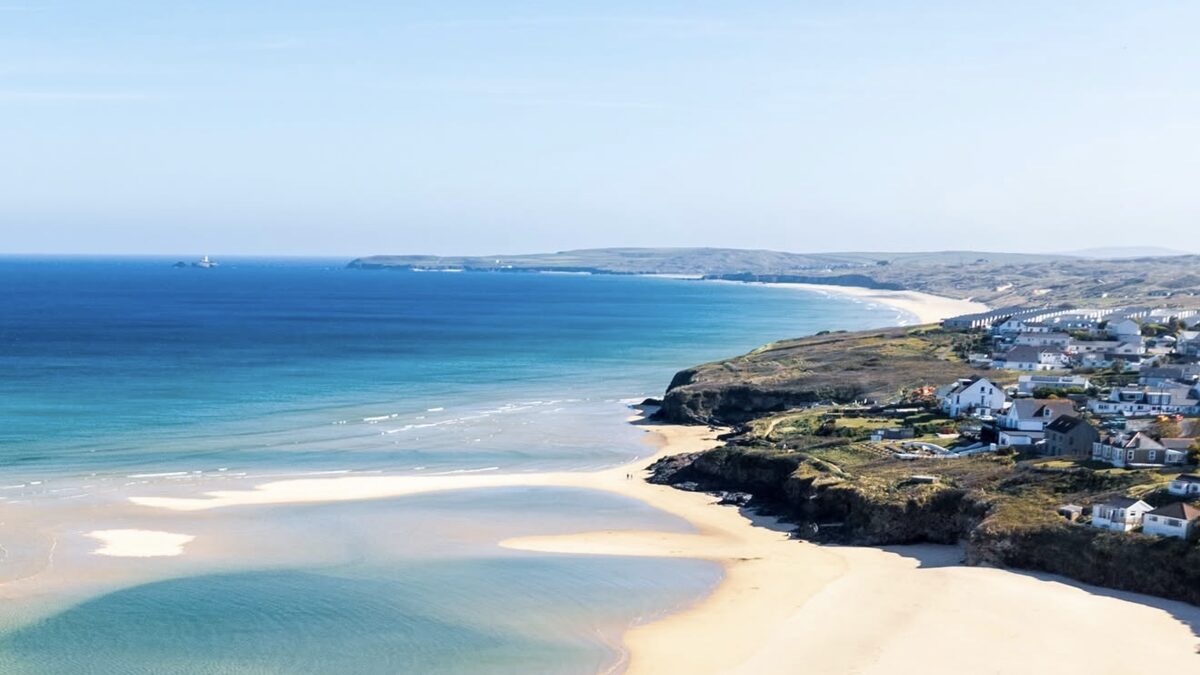 The Hayle estuary sandbars and the sweep of St Ives Bay sand at low tide, the town behind and Godrevy on the far point
