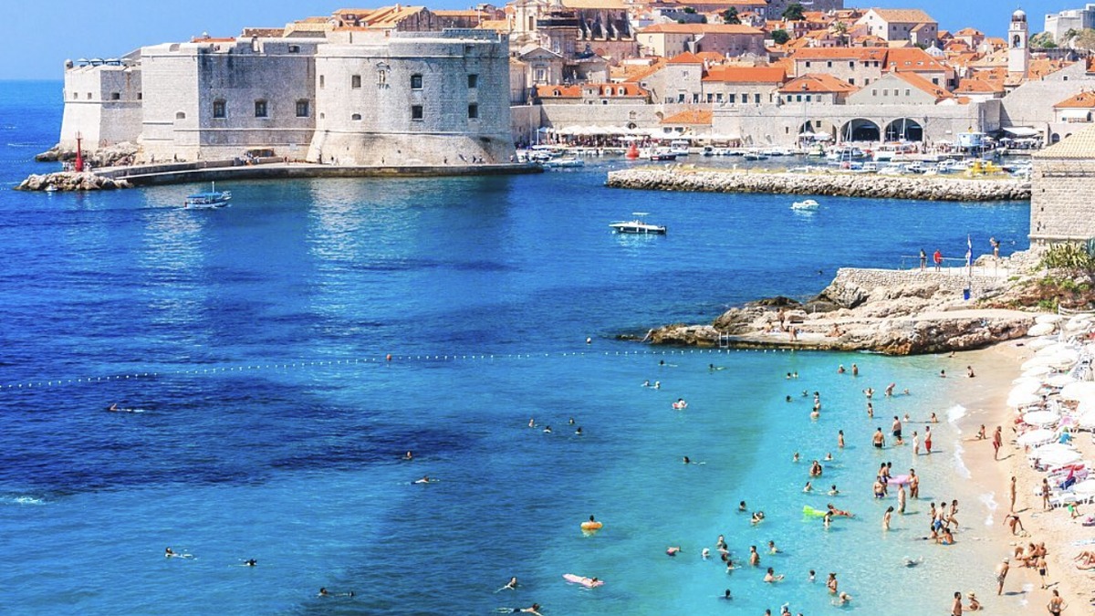 Banje Beach just outside Dubrovnik's old town walls with a view across to Lokrum Island