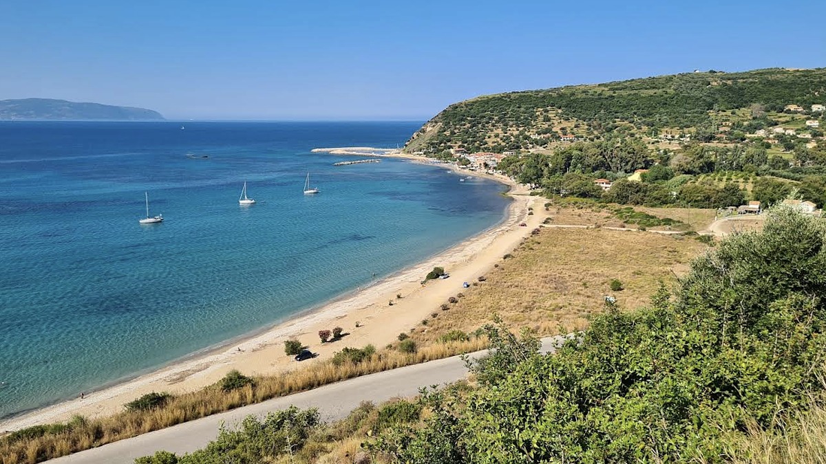 Katelios Beach in the southeast, a calm pebble-and-sand cove fronting the quiet fishing village