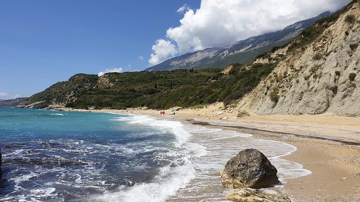 Koroni Beach near Skala, a quiet pebble beach with calm clear water and minimal development
