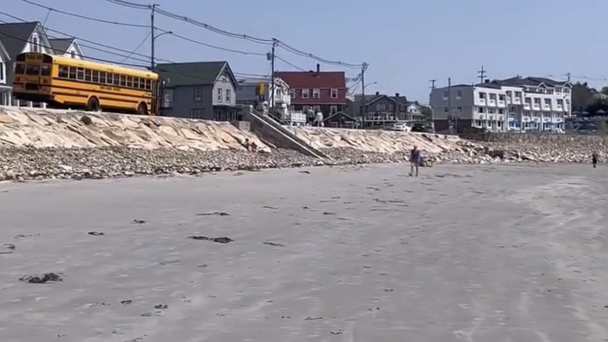Long Sands Beach in York Maine with the seawall and beachfront houses behind the sand