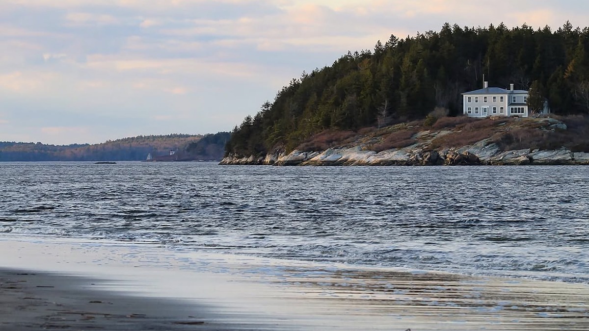 Popham Beach State Park with shifting sandbars at low tide and Fox Island offshore