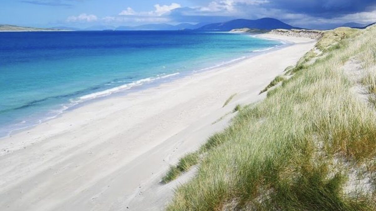 Berneray West Beach, a three-mile arc of white sand and dunes with the Harris mountains on the horizon across the sound