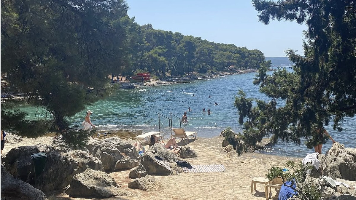 Bene Beach at the western tip of the Marjan peninsula in Split, a quiet pebble cove shaded by pines