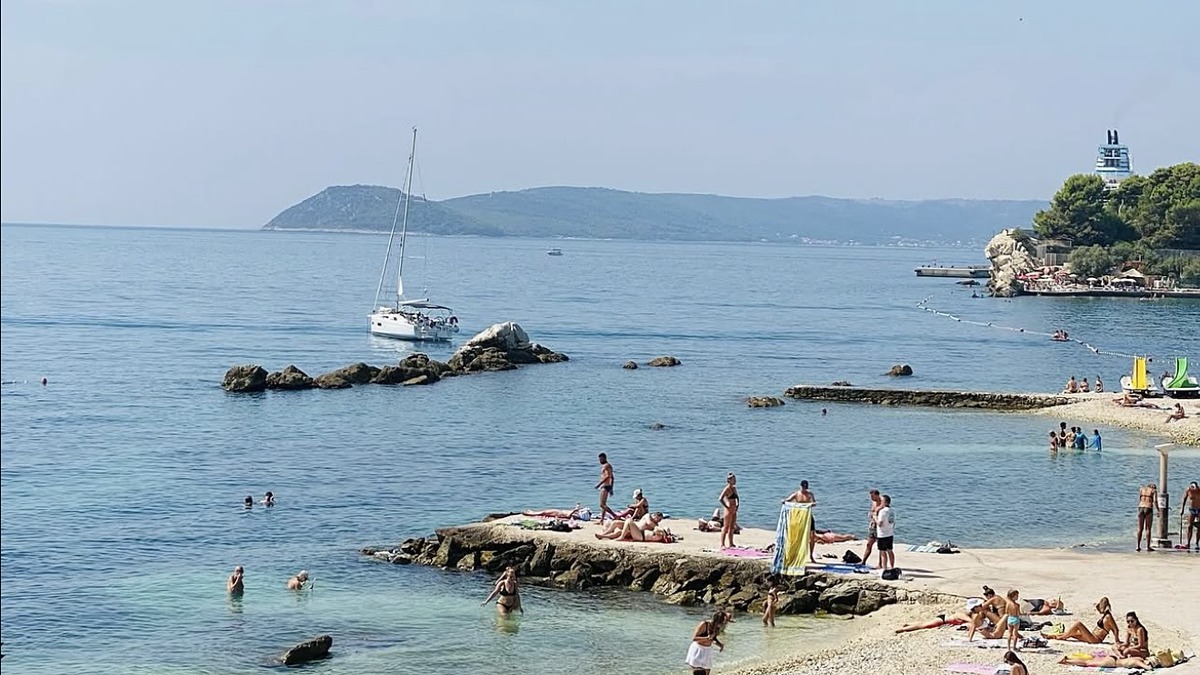 Firule Beach east of Bacvice in Split, a small sandy family beach with shallow water