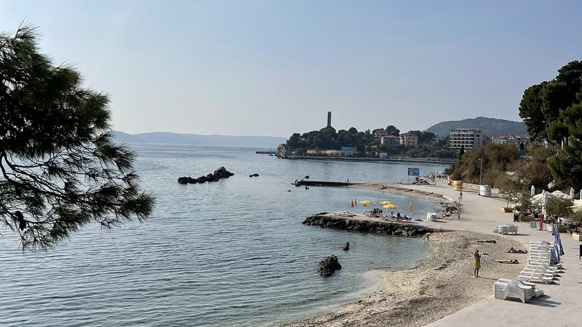 Jezinac Beach on the Marjan peninsula in Split, a small pebble cove with pine shade and clear water