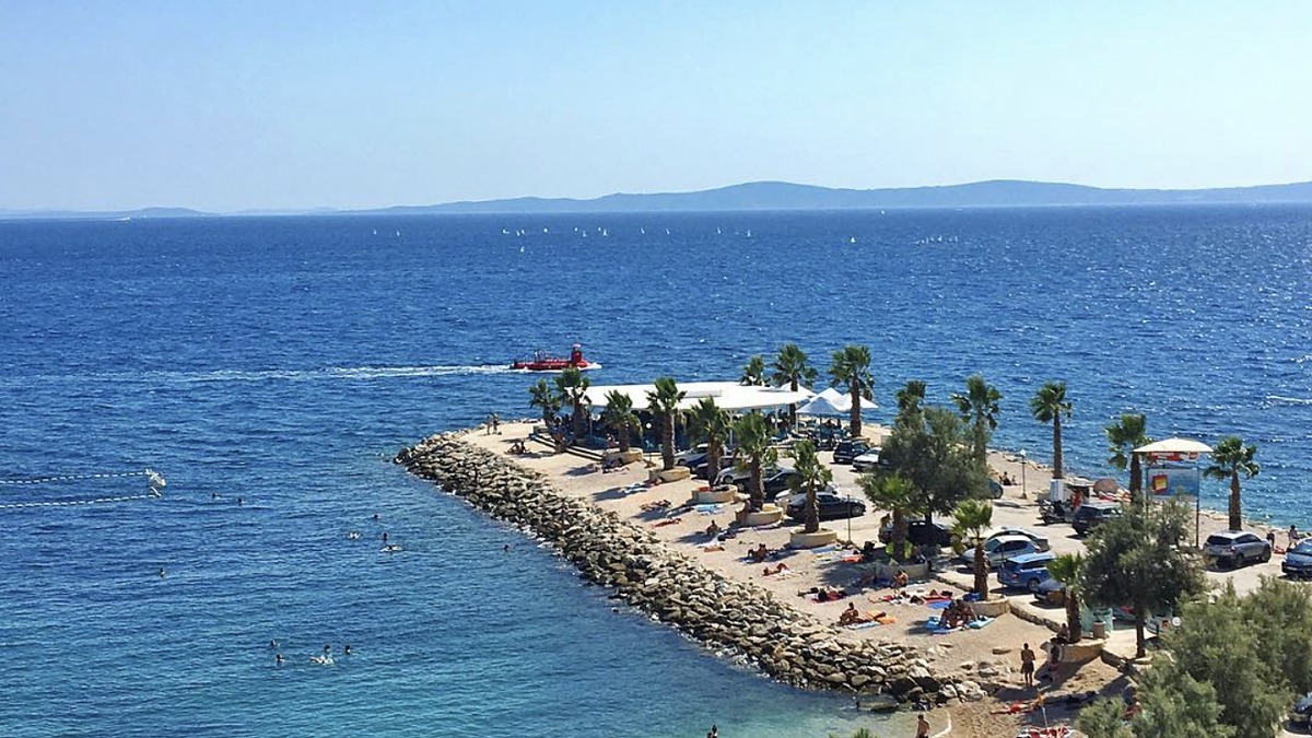 Kastelet Beach at the eastern end of the Marjan beaches in Split, a quiet clear-water pebble cove