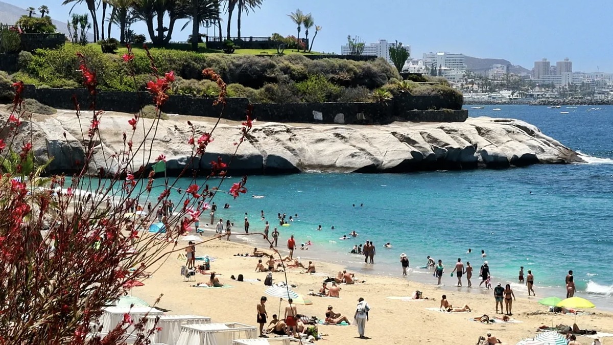 Playa del Duque in Costa Adeje, an upmarket golden-sand resort beach with calm clear water on south Tenerife