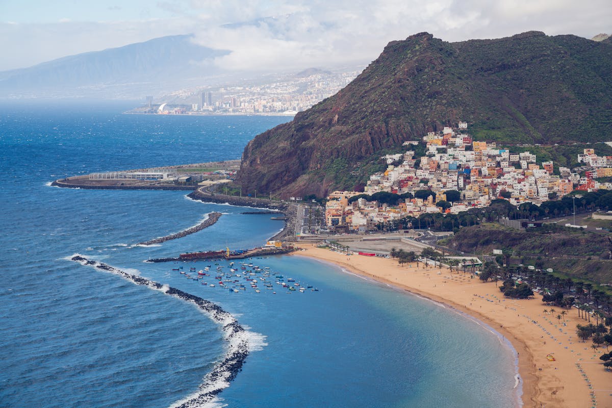 Aerial view of Playa de las Teresitas with golden sand, the village of San Andres, and Anaga mountains