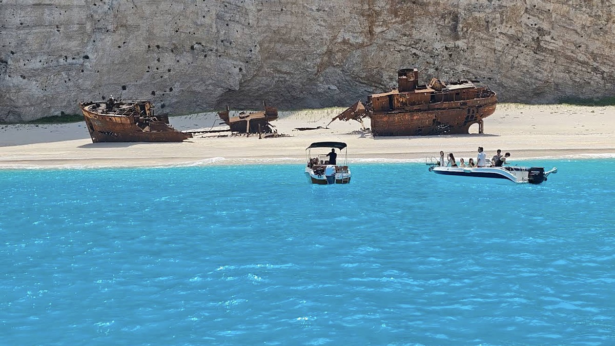 Navagio Beach (Shipwreck Beach) on Zakynthos, the rusted wreck on white sand beneath towering limestone cliffs