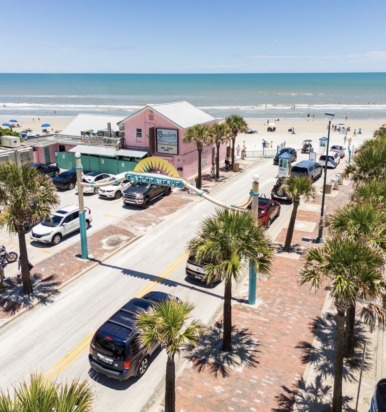 Aerial view of Flagler Avenue in New Smyrna Beach with the Atlantic shoreline in the background