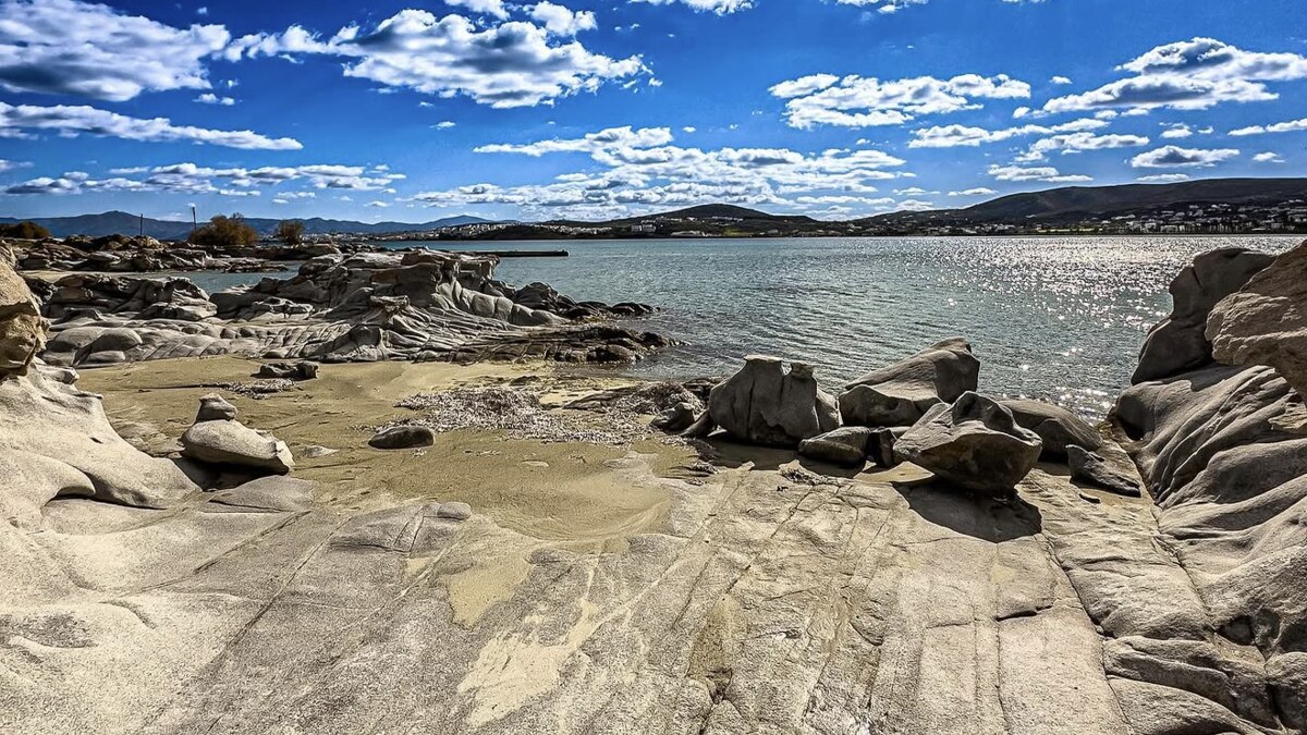 Kolymbithres beach on Paros, small sandy coves set between smooth sculpted granite boulders on the edge of Naoussa bay