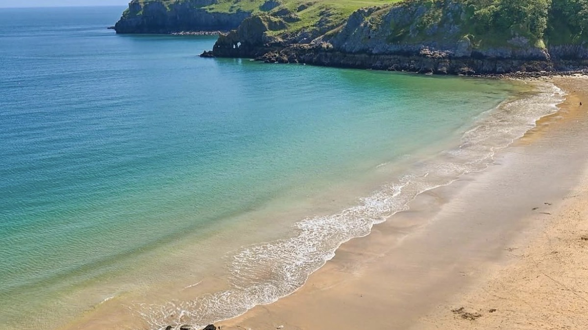 Barafundle Bay in Pembrokeshire, a golden-sand cove reached on foot with clear water and no facilities