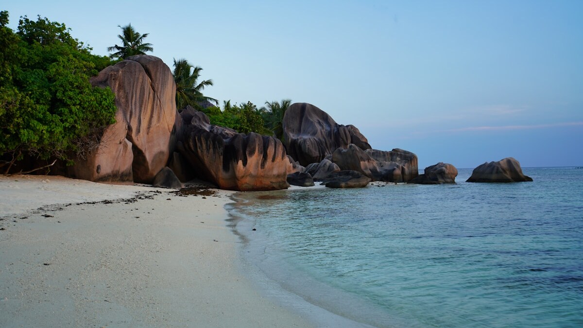 Massive granite boulders and white sand at Anse Source d'Argent beach on La Digue island, Seychelles